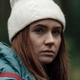 Karen Gillan in a white hat looking scared.